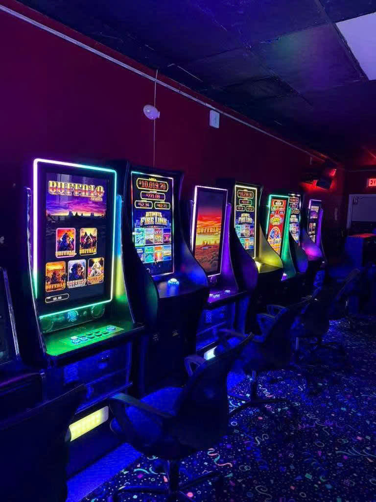 Touchscreen arcade game machines in a commercial game room Touchscreen arcade game machines in a commercial game room