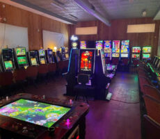 Busy arcade center with modern LED lighting and game machines